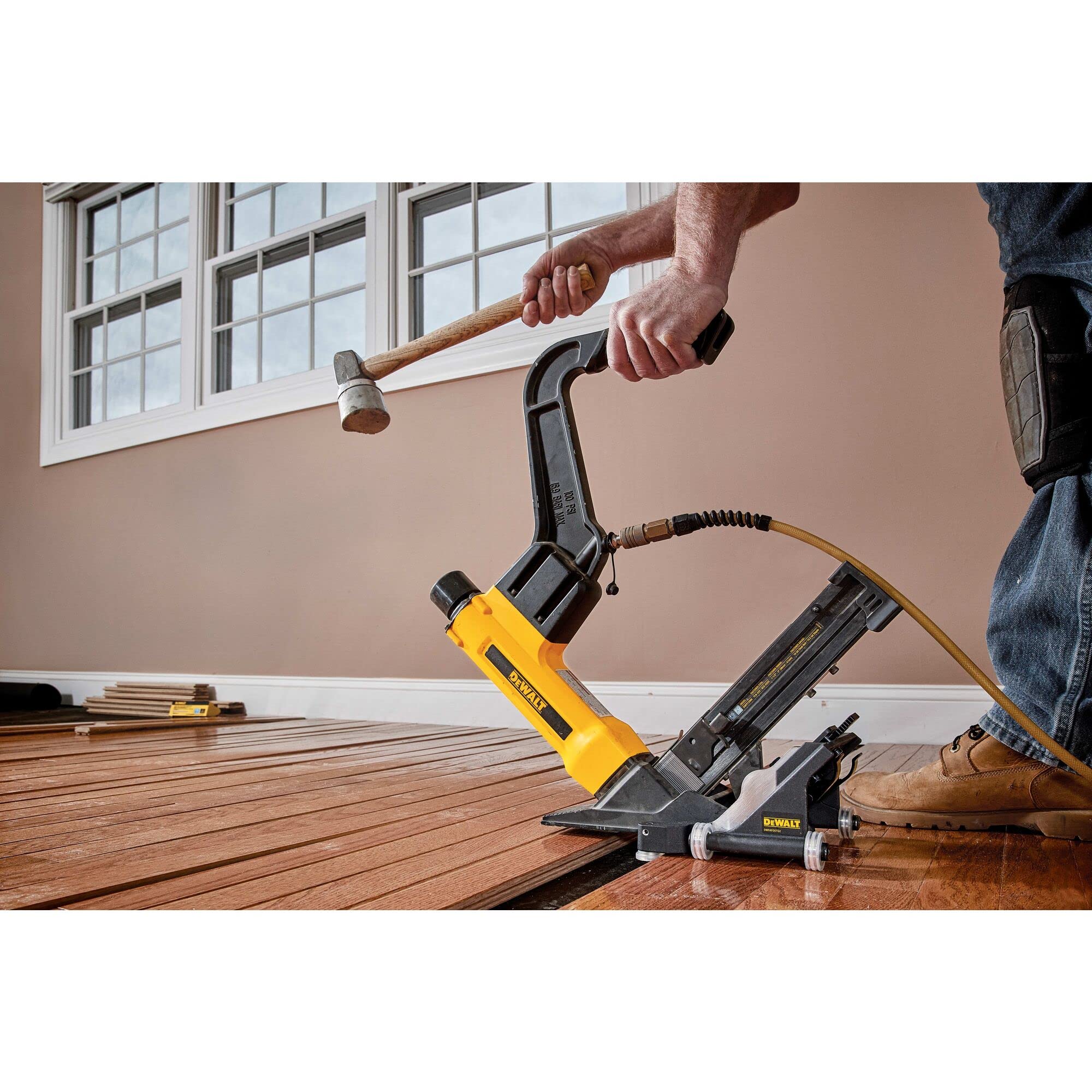 DEWALT DWFP12569 side profile highlights balanced weight for precise flooring installation.