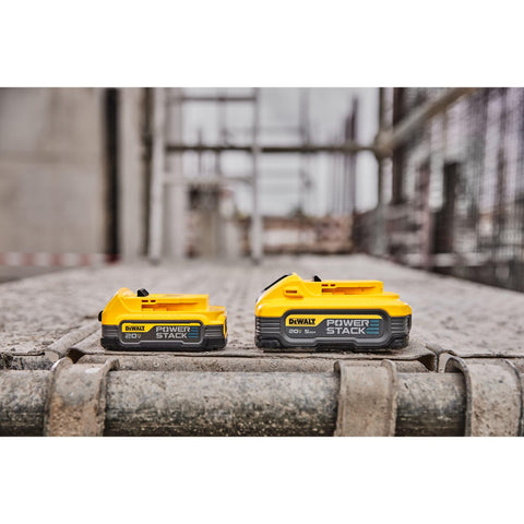 DEWALT PowerSTACK 5Ah battery in use on a busy worksite emphasizing extended runtime