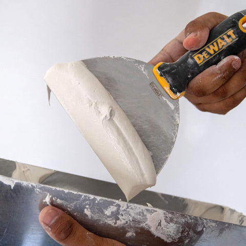 DEWALT putty knife double riveted handle for secure, durable use.