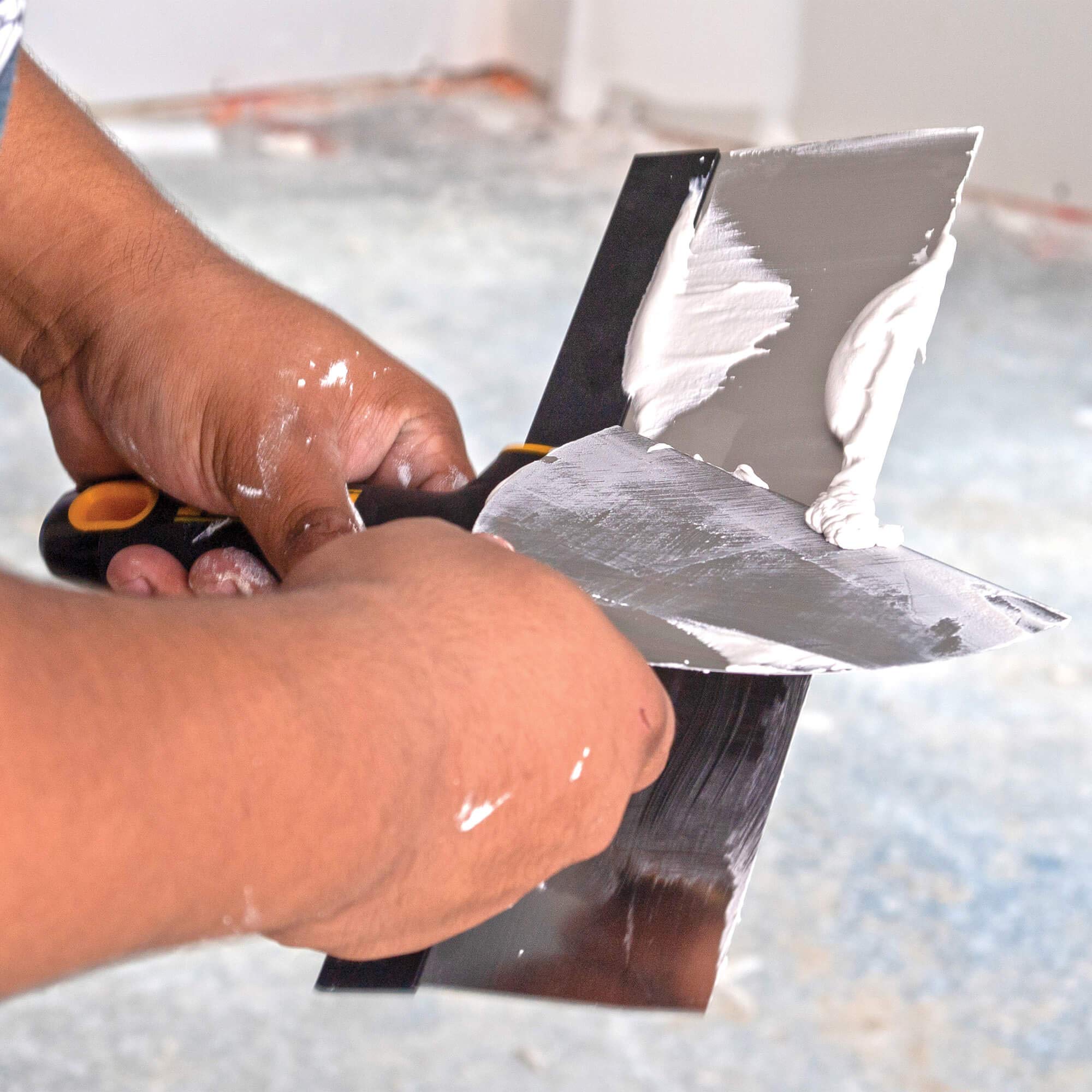 DEWALT 10-inch tapping knife with premium blade for faster application.