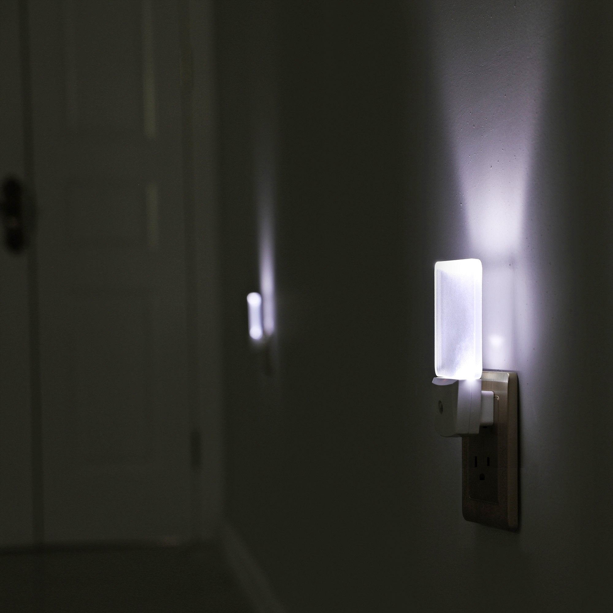 DEWENWILS night light with non-polarity plug shares space for a second outlet.