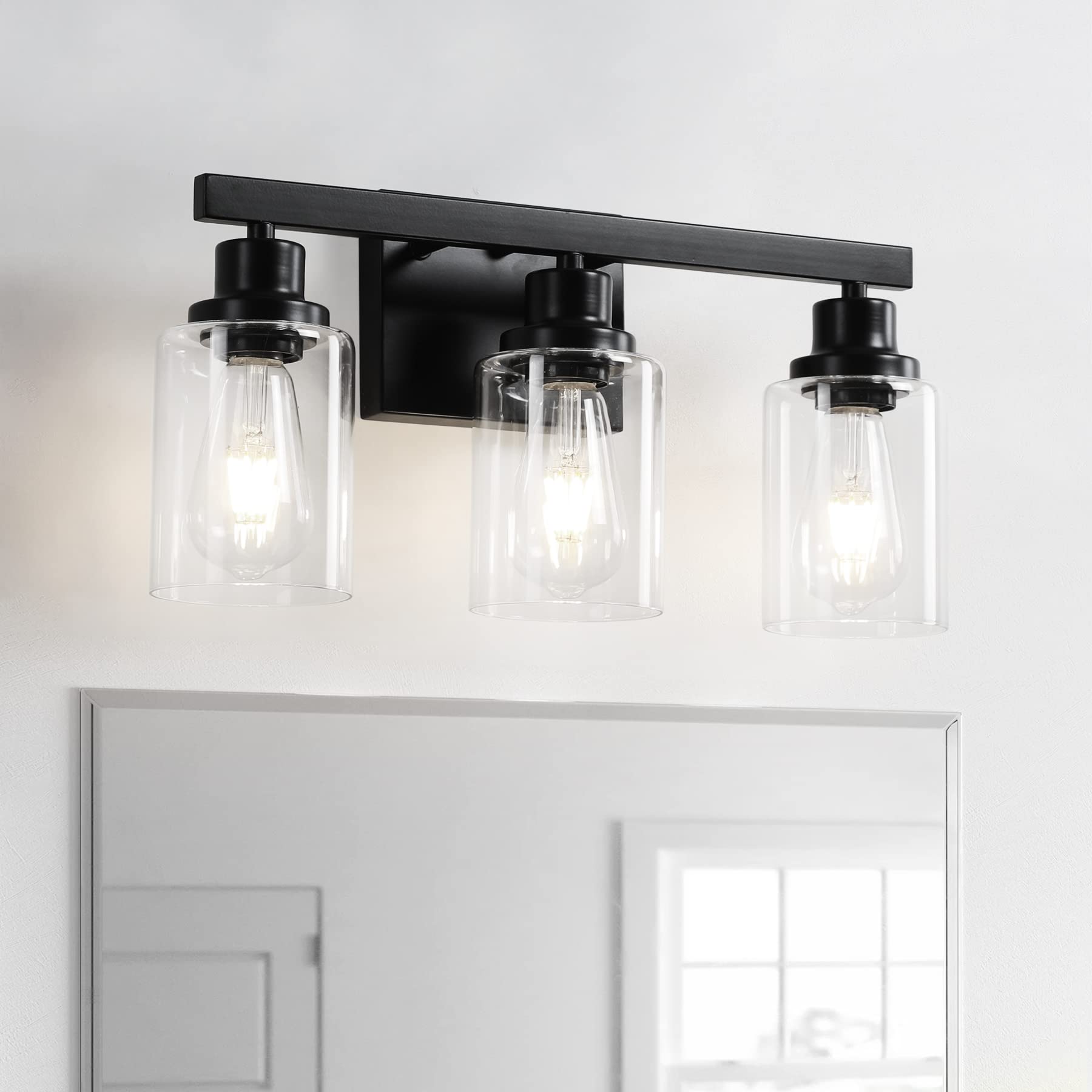 DIKAIDA 3-light bathroom fixture with clear glass shades for bright mirror lighting.