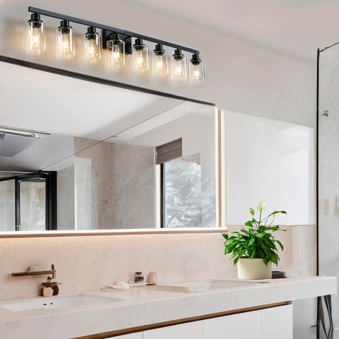 DIKAIDA 52 inch matte black vanity light illuminates the mirror area