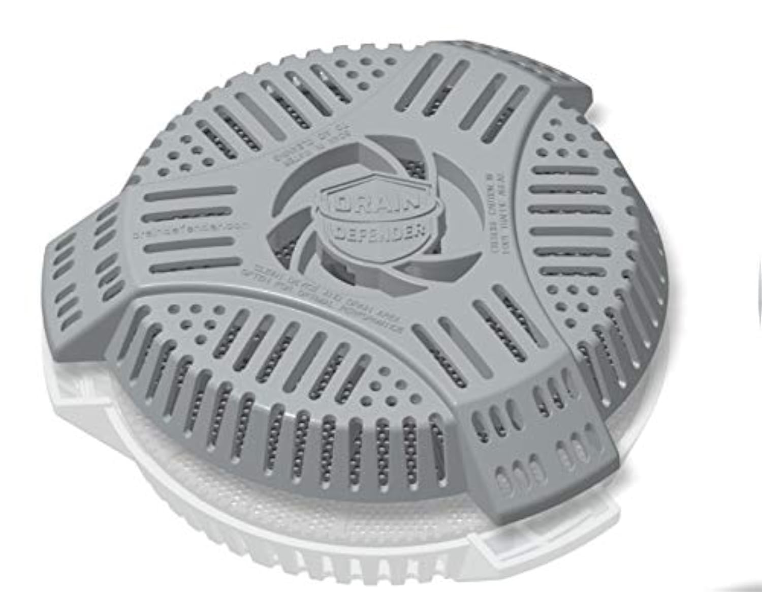 Drain Defender two-stage cover over a round drain blocks yard debris.