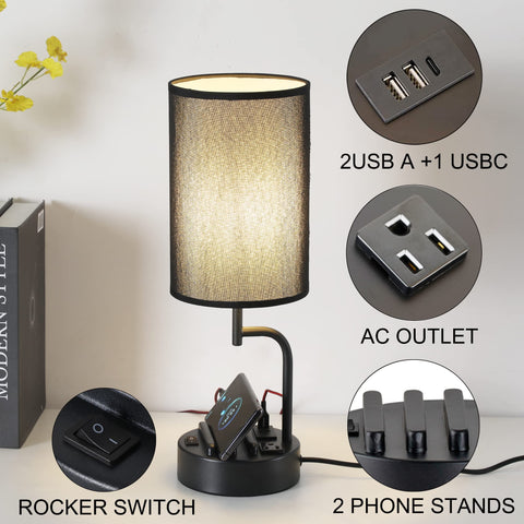 Dreamholder table lamp with black metal base and phone holders to organize bedside devices.