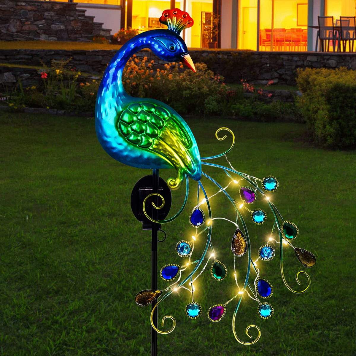 DREAMSOUL metal peacock garden stake light provides warm LED ambiance for outdoors.