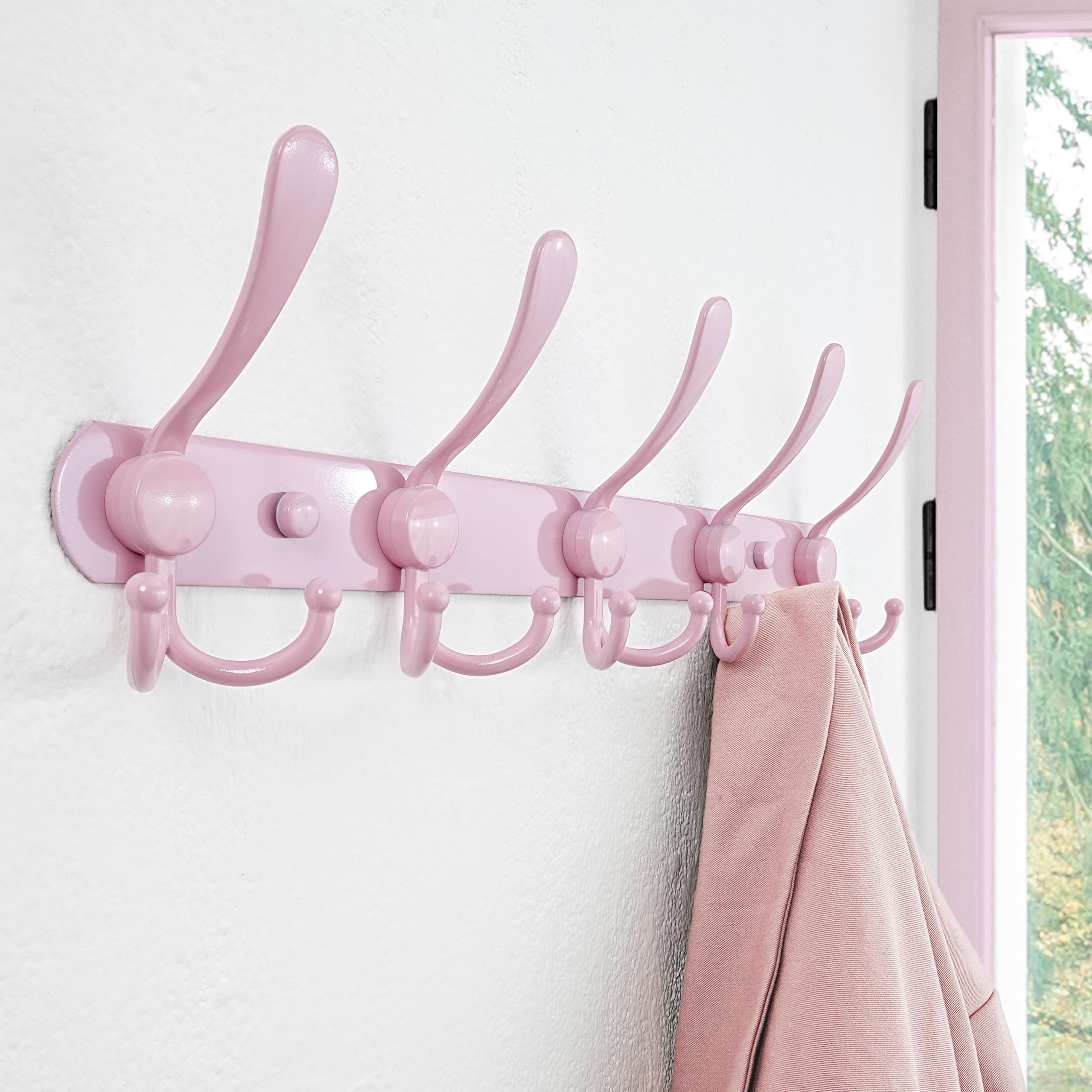 Dseap pink wall-mount coat rack installed in a mudroom for quick access.