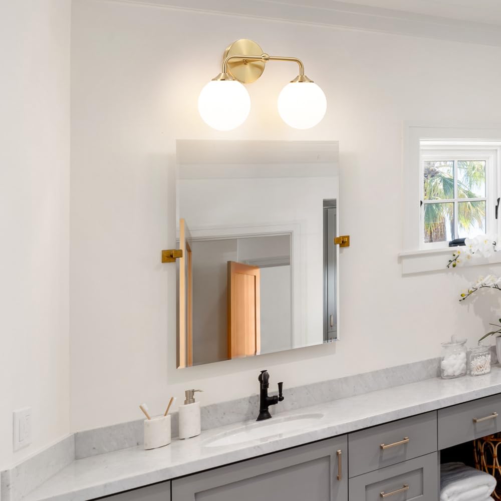 DSMJFU Brass wall sconce with milky shade enhances elegant mirror lighting.