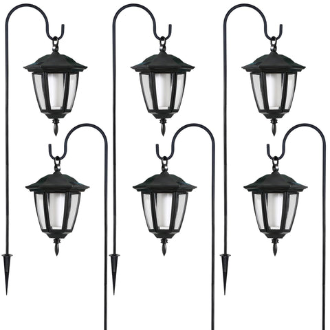 Dynaming lanterns along driveway guide guests with welcoming light