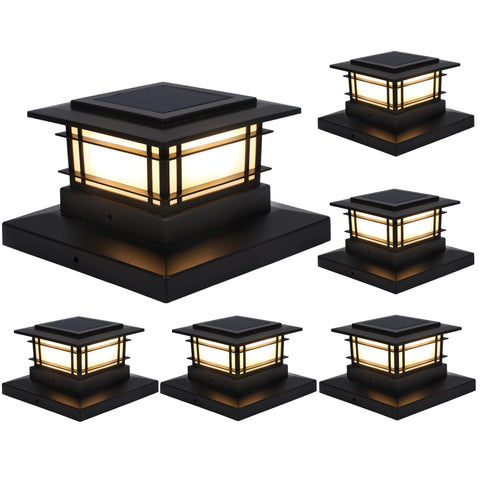 Dynaming solar post cap lights on wooden posts create gentle fence-line illumination.