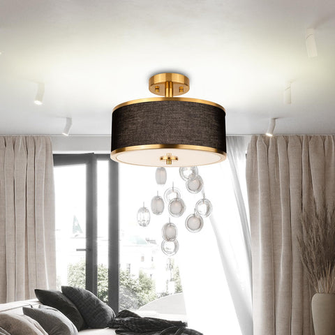 Edwarmlux gold brushed metal frame complements the white linen drum shade