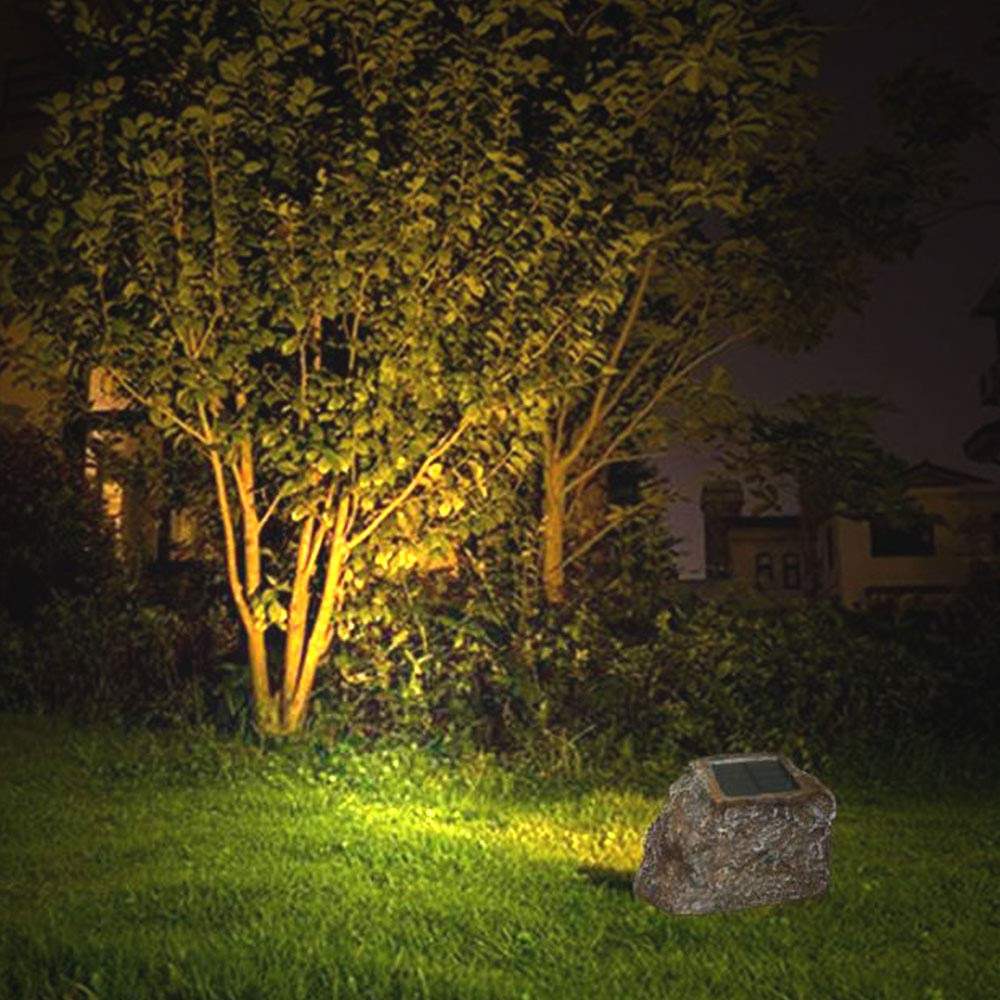 Natural rock appearance blends with yard decor using EiGreen lighting.