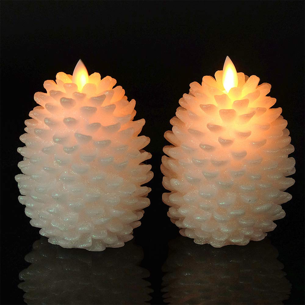 Mantel centerpiece setup with two pine cone candles.