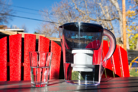 Water being poured from Epic Pure pitcher using Pure XP shows clear, clean water.