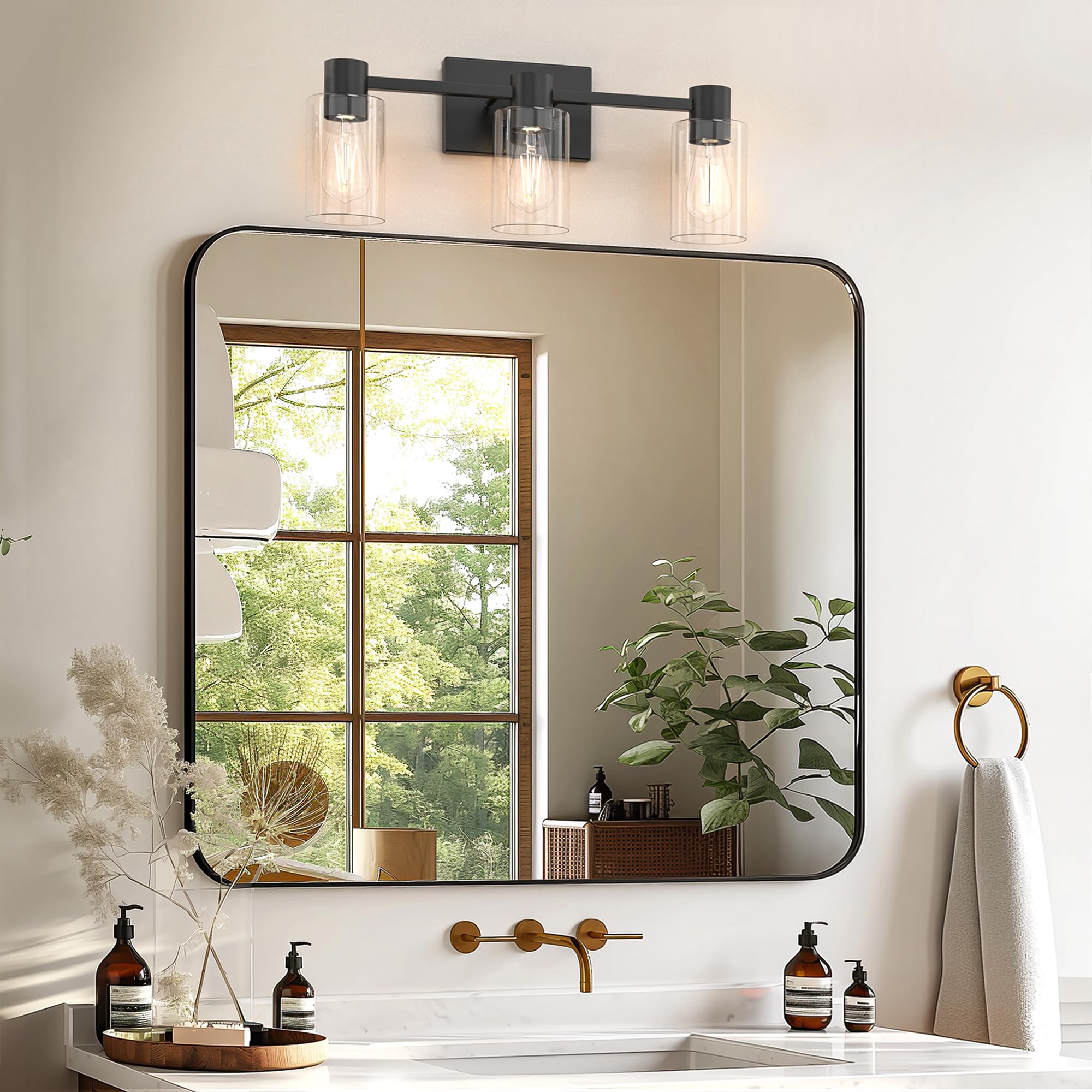 Esfos bathroom vanity light with clear glass shade adds contemporary flair and bright task lighting.
