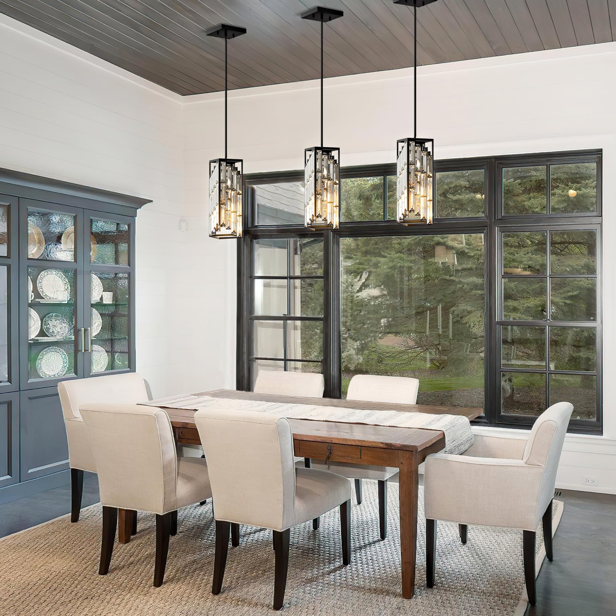 Esfos dining room setup featuring black pendant lights for focal glow