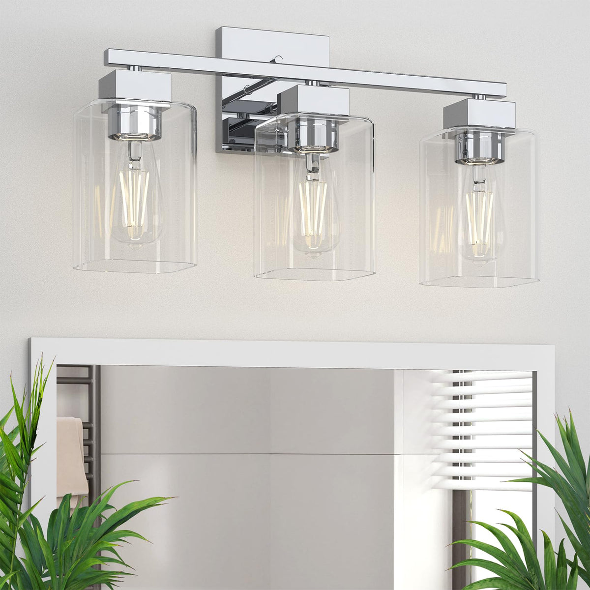 Espird chrome bathroom light over mirror with three bulbs for bright, even illumination.