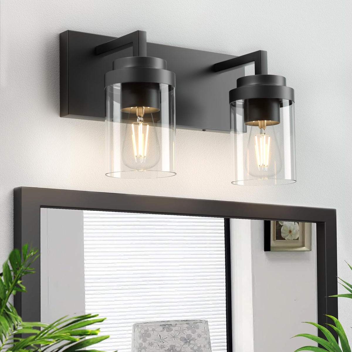 Espird two-light vanity light in matte black with clear glass shades.