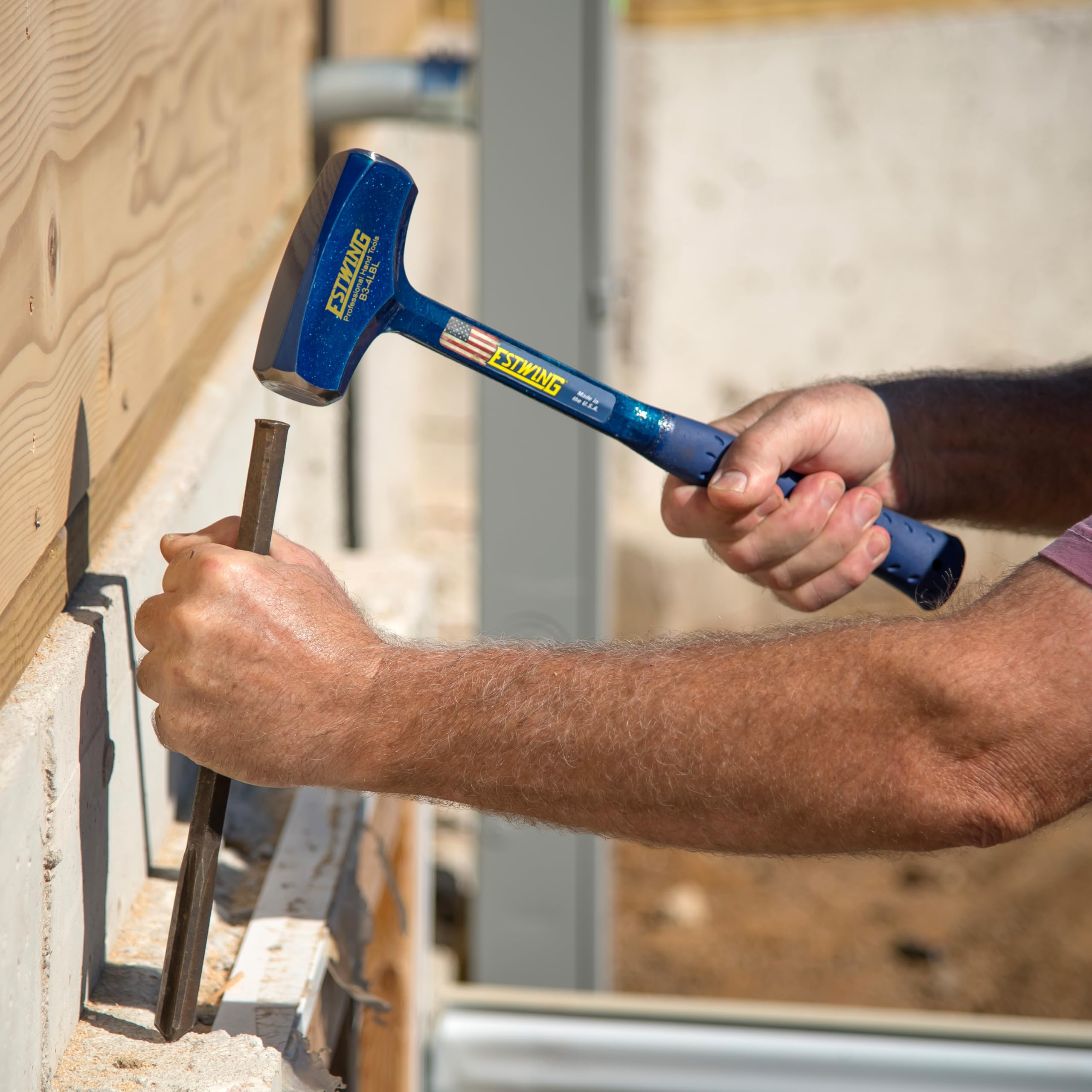 Estwing Big Blue drilling hammer used with chisels and punches for precise work.