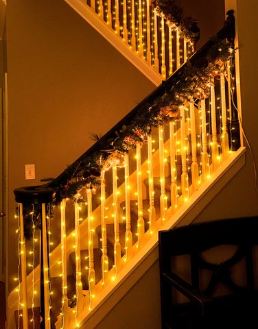 Eueasy 300 LED setup brightens fences and pergolas with warm ambiance.