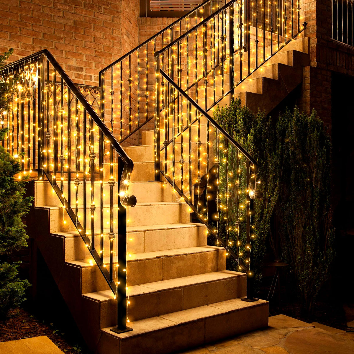 Eueasy curtain lights outdoor create waterfall glow on balcony for cozy evenings.
