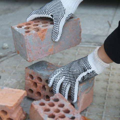 Evridwear gardening and construction gloves protecting hands during digging and cleanup.