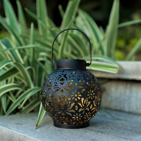EXCMARK lanterns on shepherd hooks offer flexible outdoor lighting options.