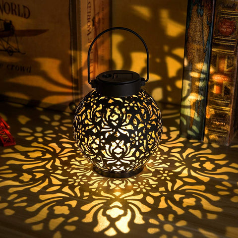 EXCMARK 2-pack outdoor solar hanging lanterns illuminate patios with metal LED glow.