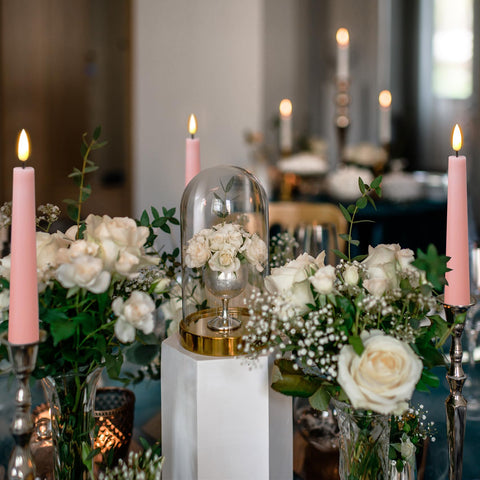 Eywamage Christmas ambiance with pink flameless candles on a mantel