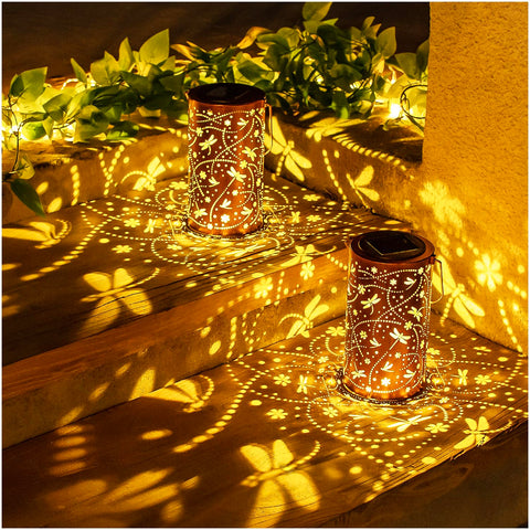 EZTZEN Dragonfly solar lantern at dusk emits warm path lighting