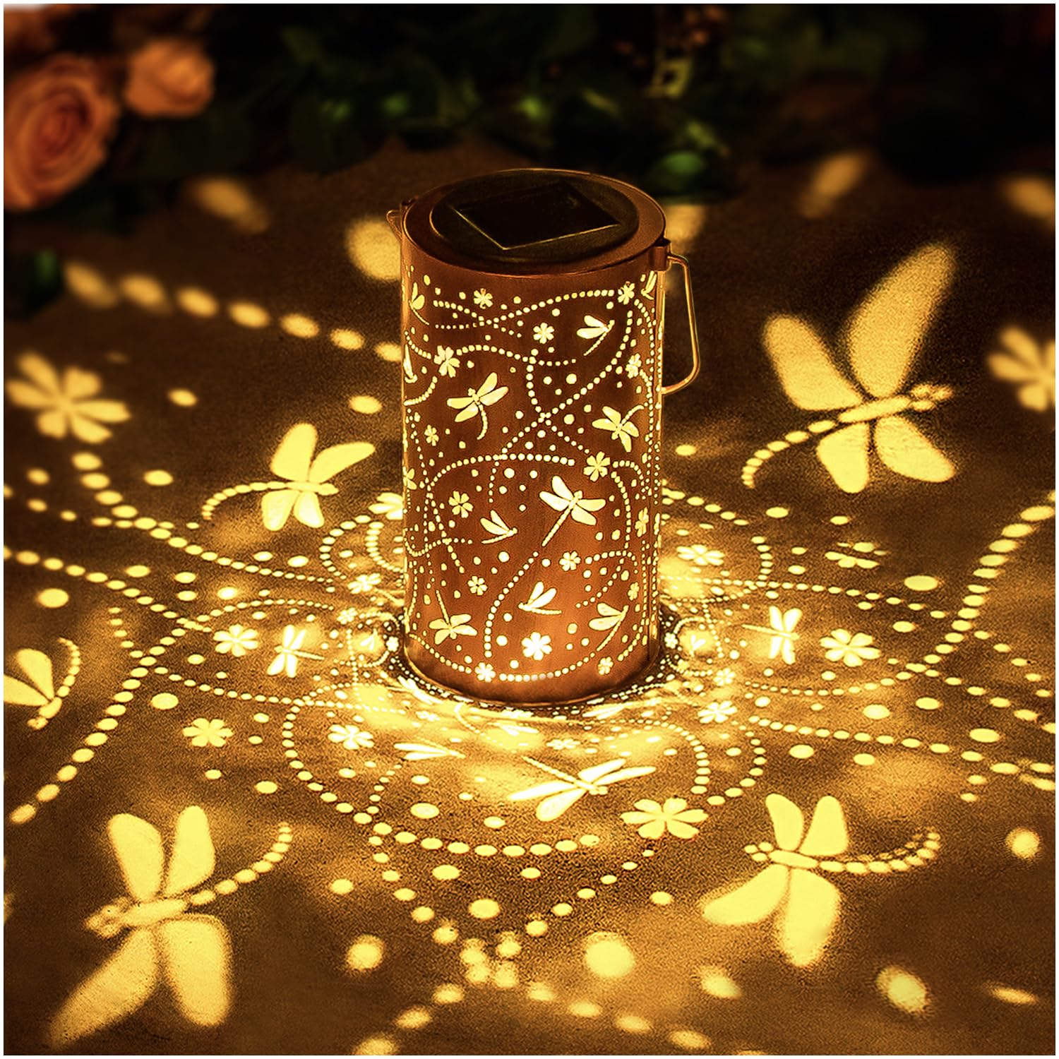 EZTZEN Dragonfly solar lantern casts decorative garden patterns at dusk
