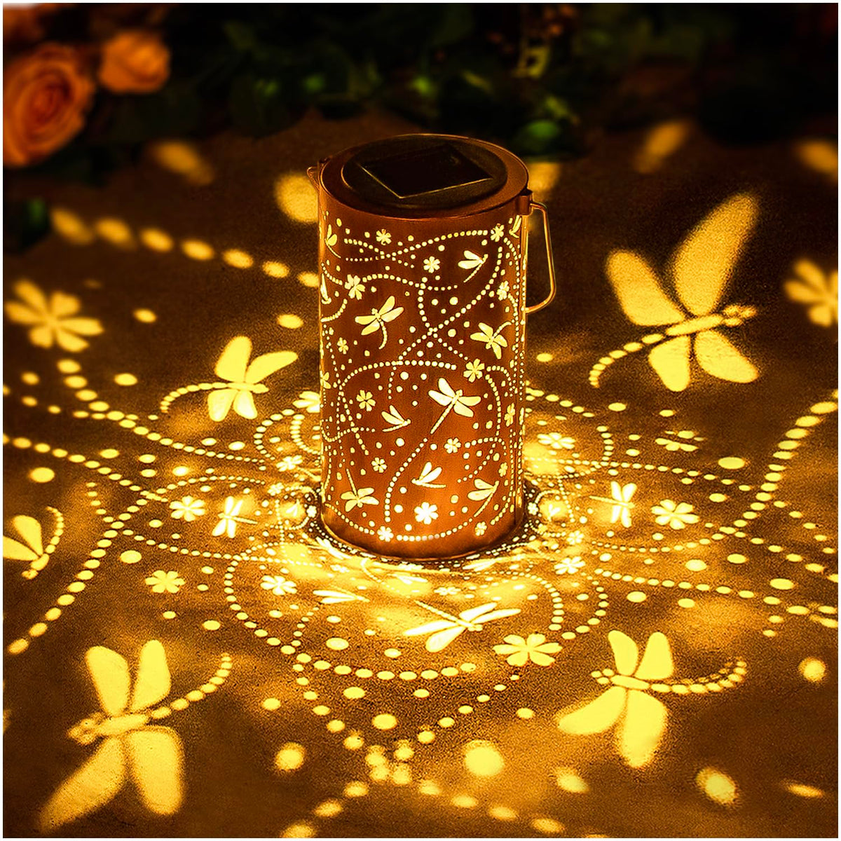 EZTZEN Dragonfly solar lantern casts decorative garden patterns at dusk