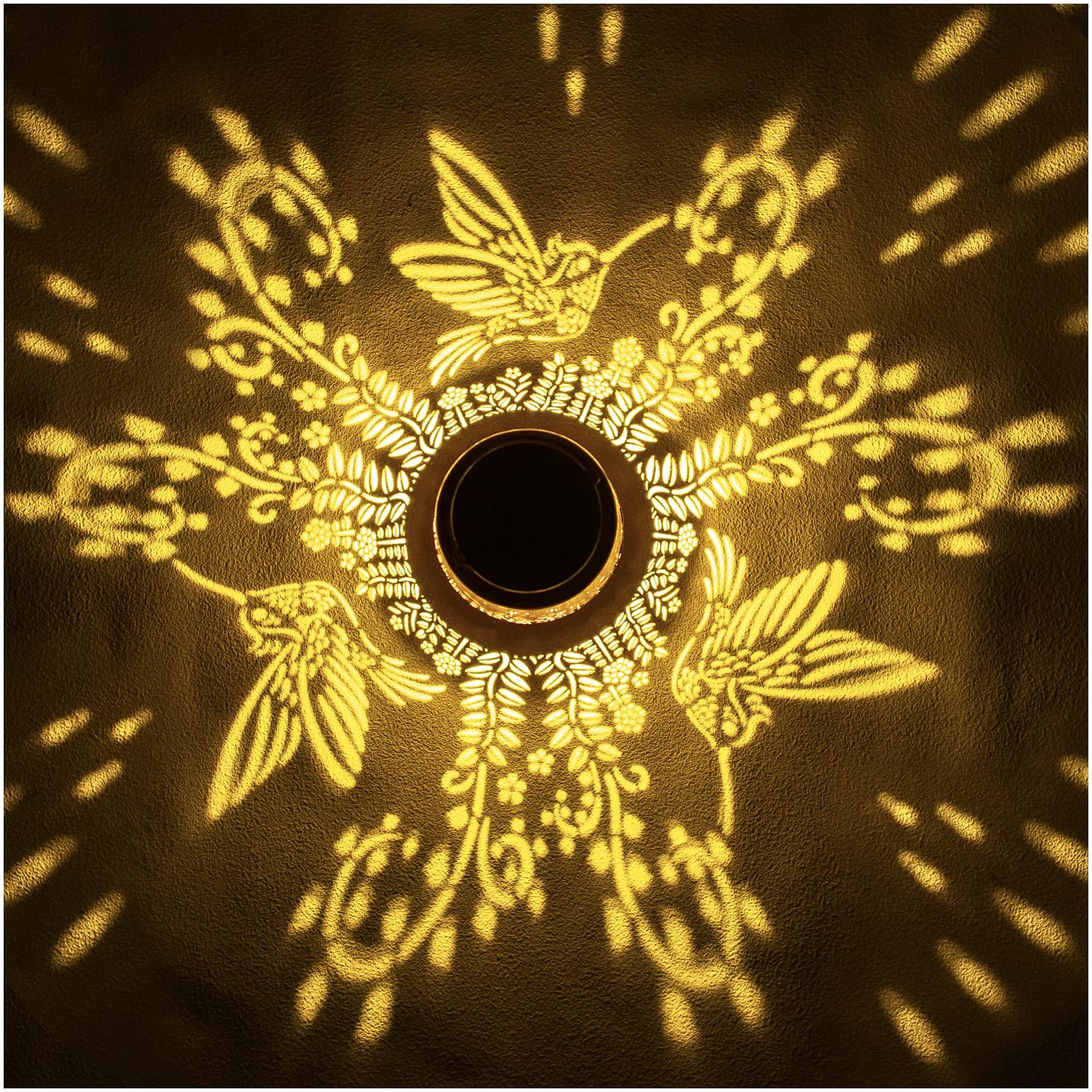 EZTZEN hummingbird solar lantern pattern projection enhances outdoor decor after dusk.