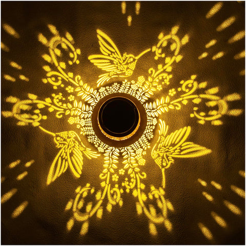 EZTZEN hummingbird solar lantern pattern projection enhances outdoor decor after dusk.
