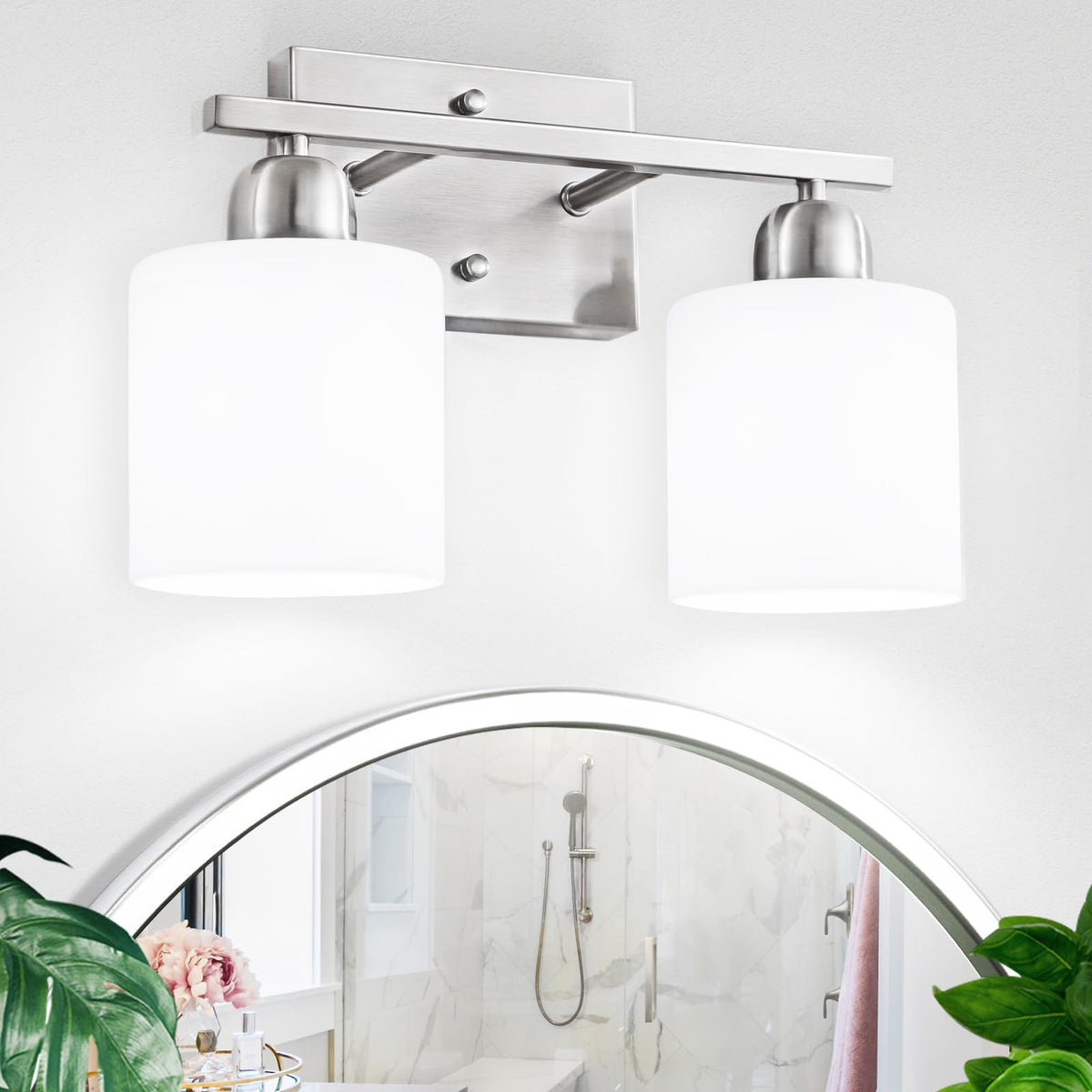 FAISHILAN brushed-nickel 2-light bathroom light illuminating a vanity mirror with balanced glow