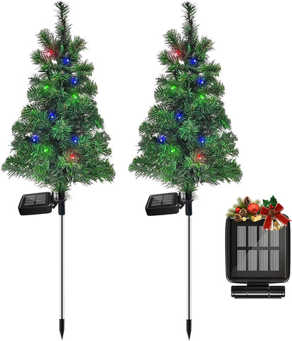 FanFX solar Christmas tree stake lights illuminate outdoor pathways at night