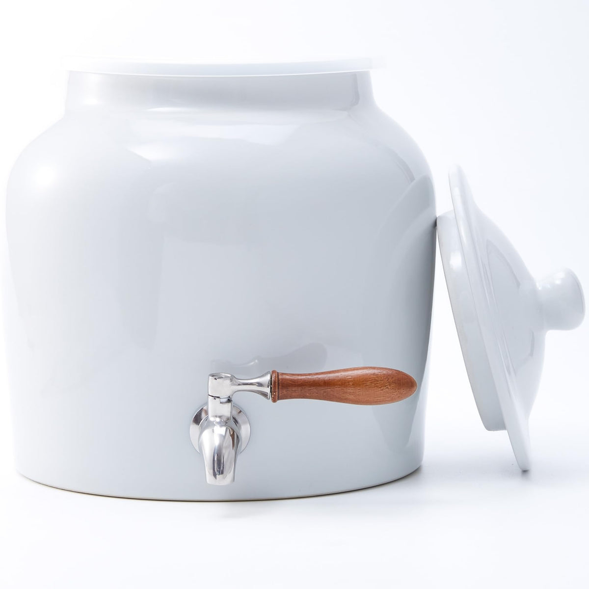 FAQQI ceramic water dispenser with a 5-gallon bottle for home use.