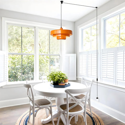 FCTWAKS mid-century orange pendant enhances dining areas with warm vintage charm.