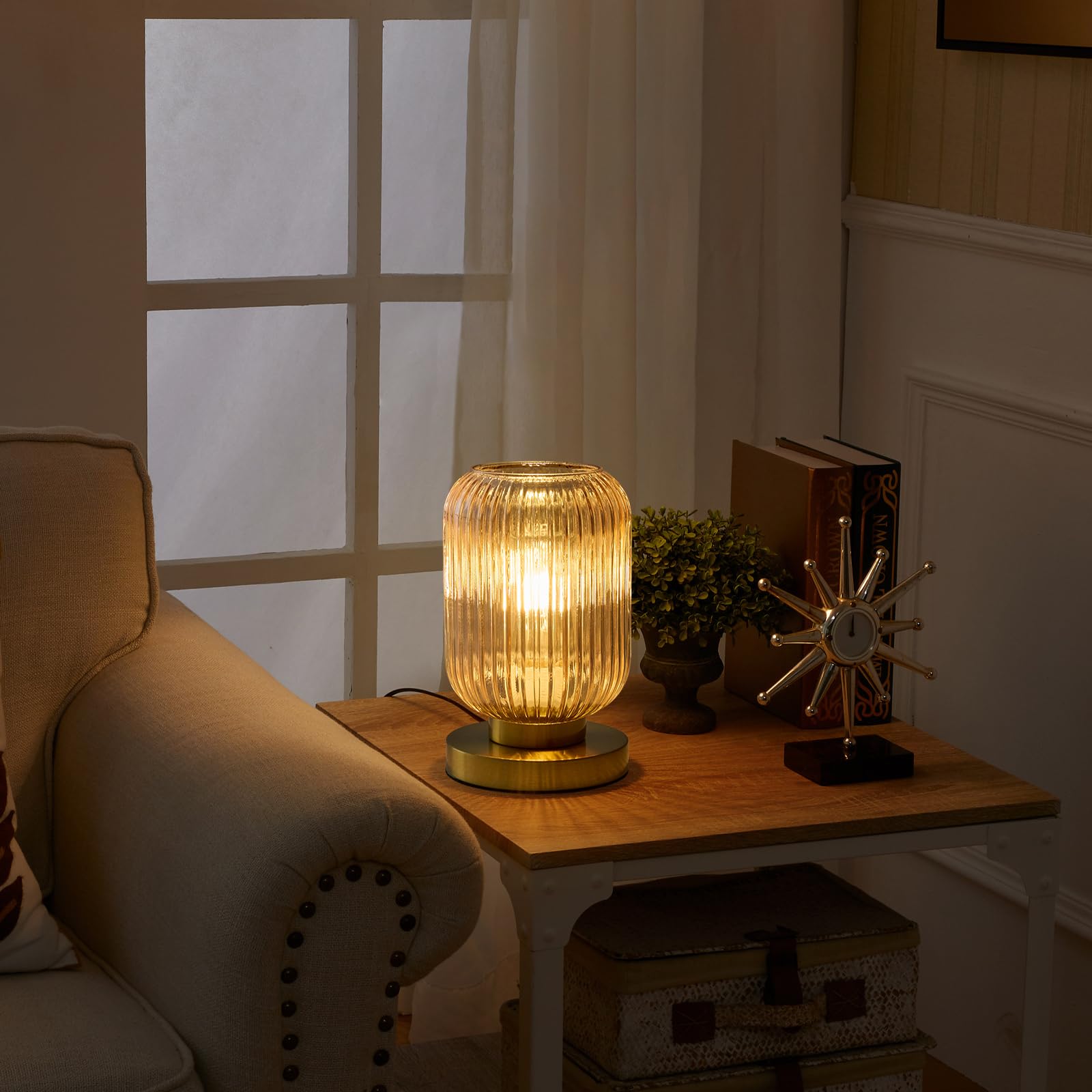 Feasey amber-globe dimmable lamp for customizable mood lighting.