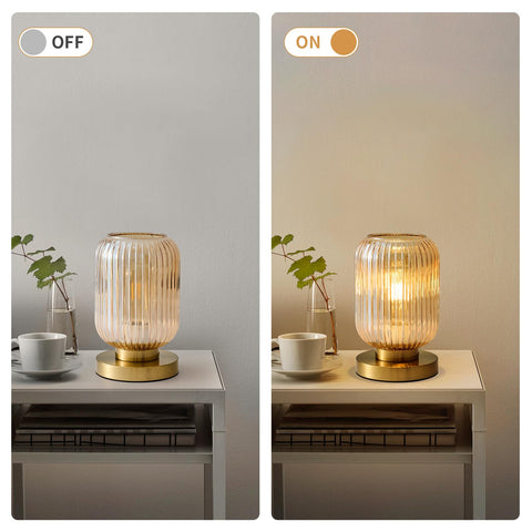 Feasey gold base table lamp provides sturdy support with vintage charm.