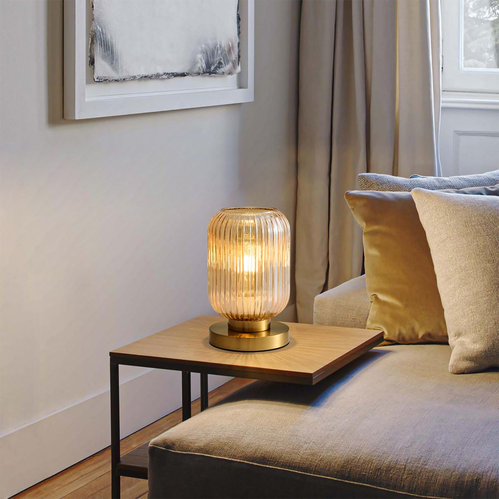 Feasey nightstand lamp offers warm glow for reading and relaxation.