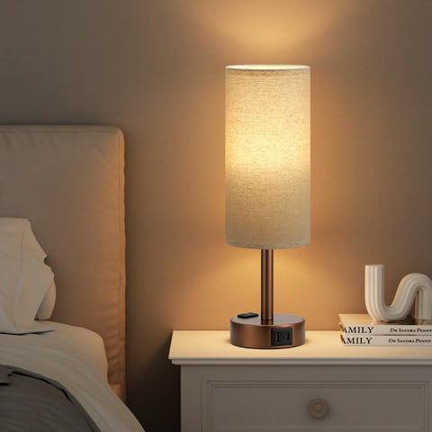 Fenmzee flaxen shade diffuses light softly in a bedroom or desk.