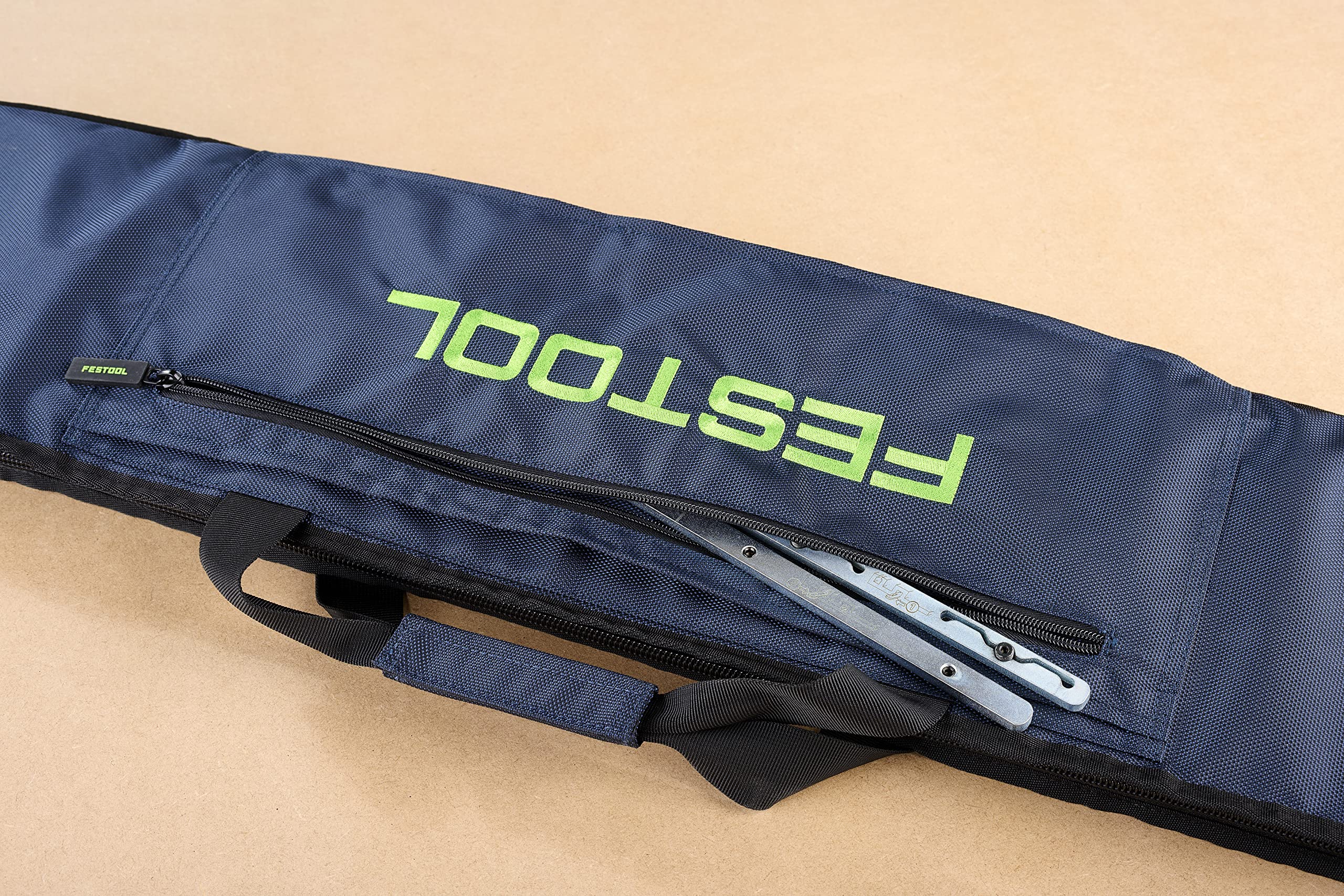 Festool carrying case shoulder-strap illustrates easy on-site carrying.