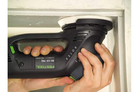 Festool Granat 5-Inch disc smoothing a finish-ready surface.
