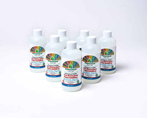 Flamecheck M-111PA being poured into a gallon of latex paint for easy mixing