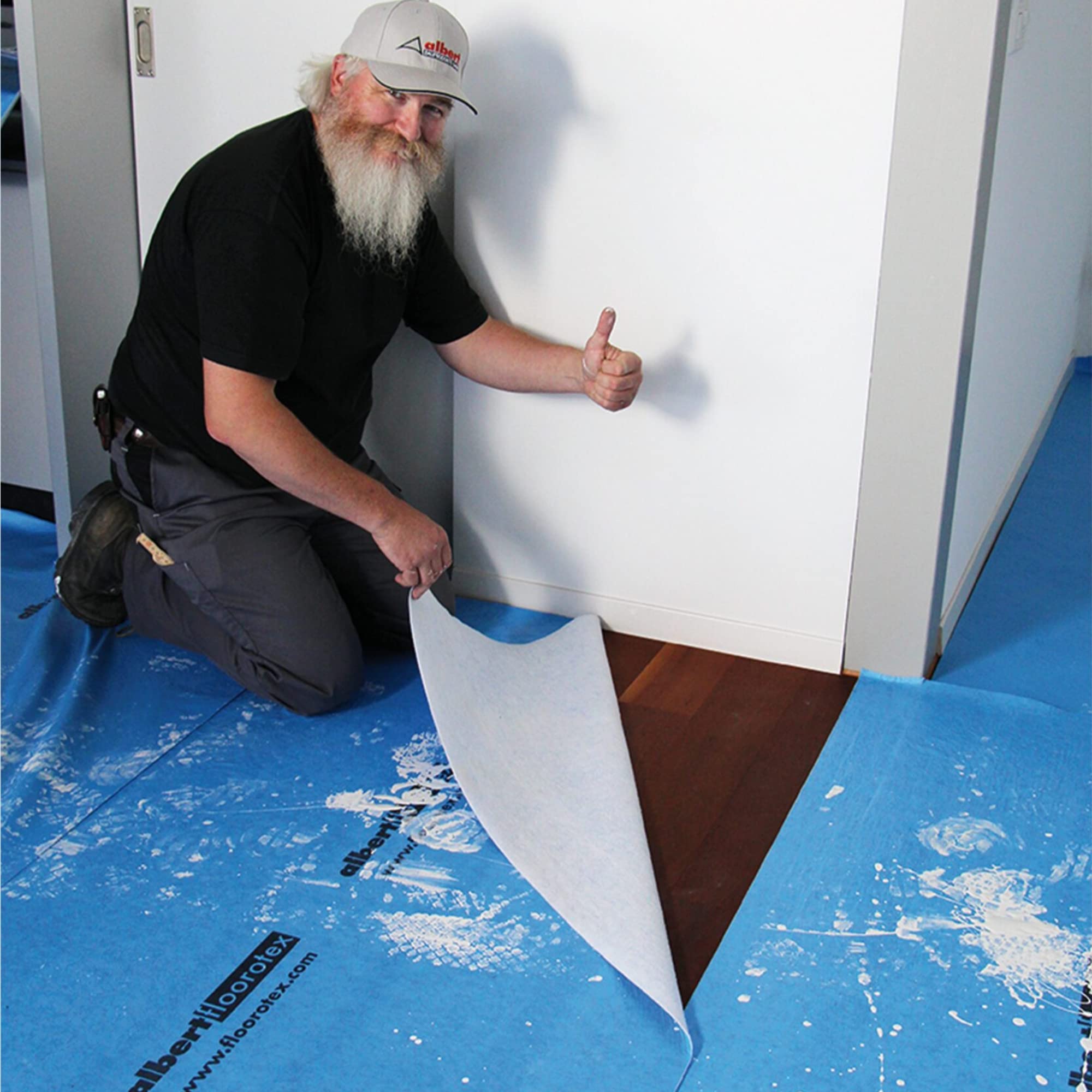 Floorotex Albert Blue roll guarding hardwood floors during painting projects.
