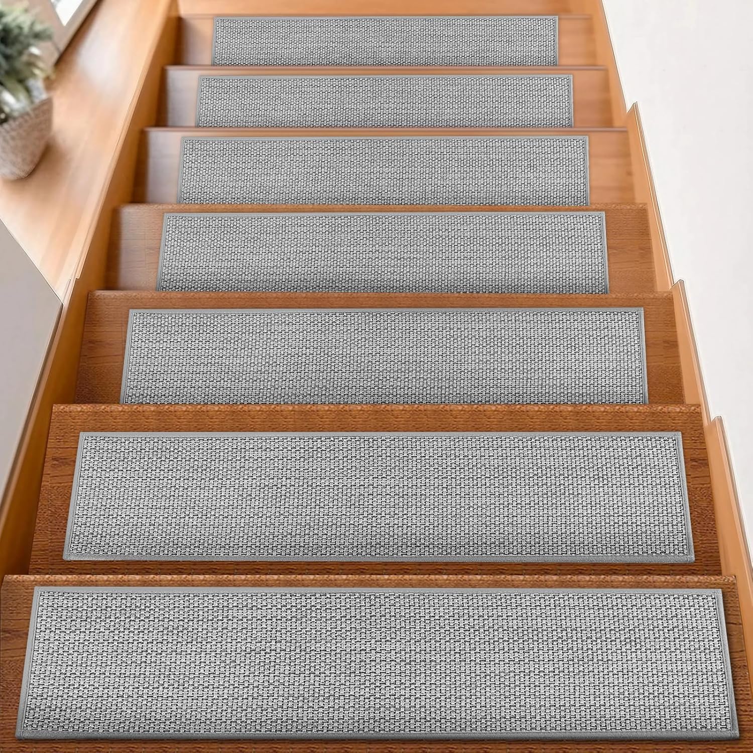 FlowaFoli stair treads 8x30 grey on wooden stairs for secure footing.