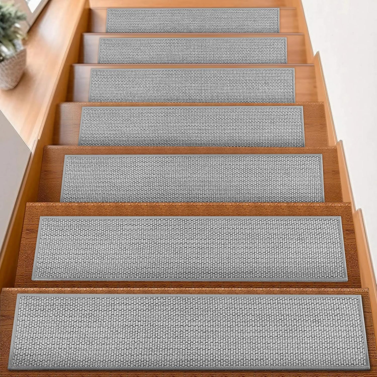 FlowaFoli stair treads 8x30 grey on wooden stairs for secure footing.