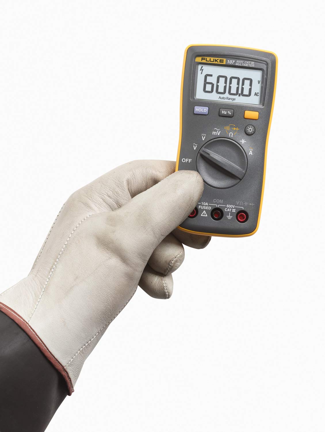 Fluke 107 handheld meter measuring AC/DC current and voltage on the job
