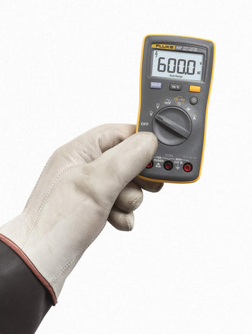 Fluke 107 handheld meter measuring AC/DC current and voltage on the job